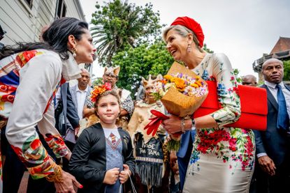 Queen Maxima of the Netherlands wore a stunning red, floral outfit in South Africa 