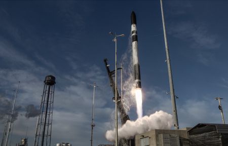 An image of a rocket launching off a launch pad