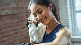 a photo of a sweaty woman after finishing a workout