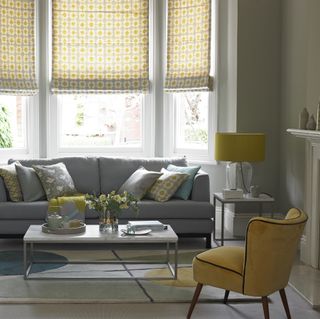 small grey living room with yellow chair