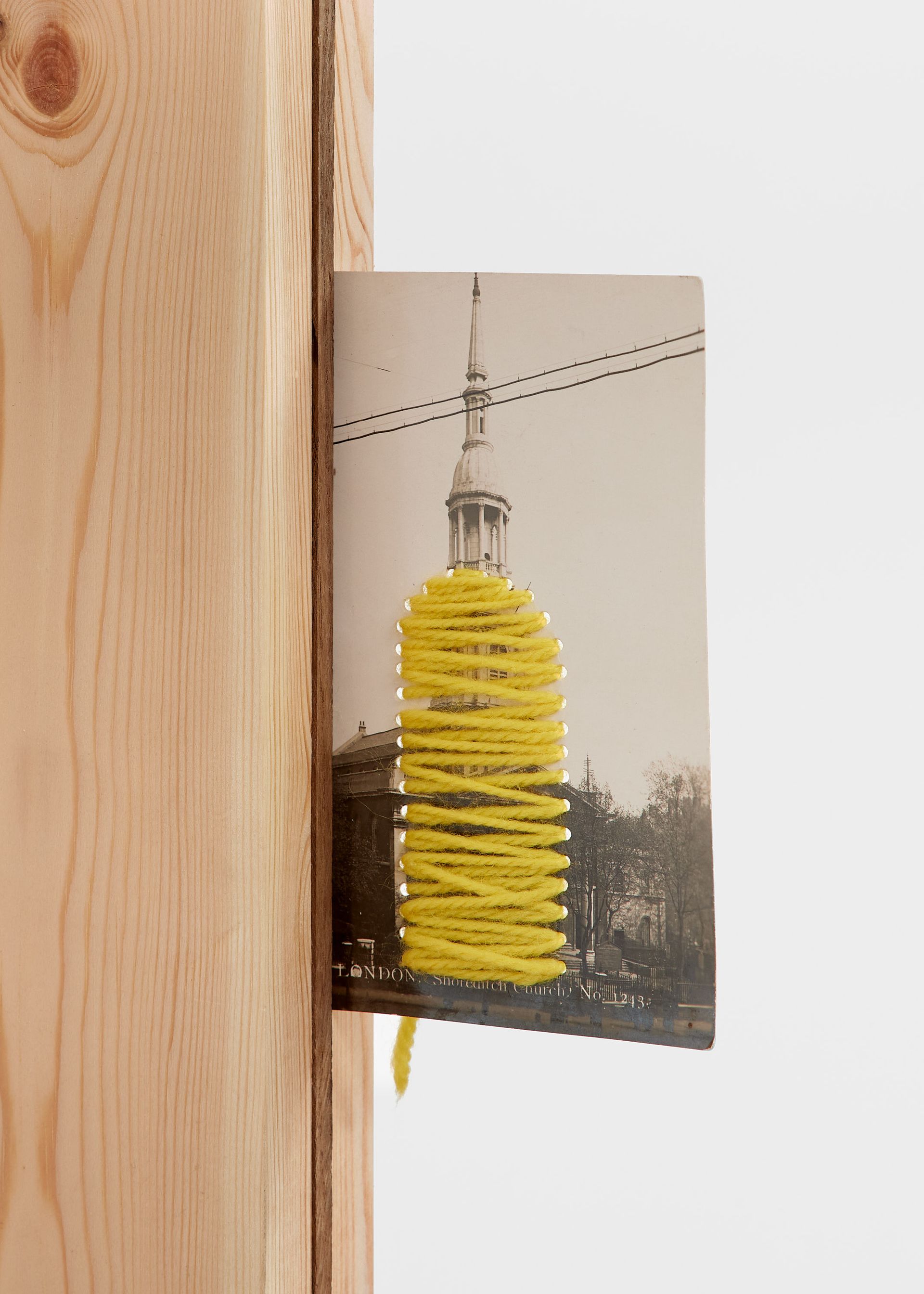 Artwork of wool woven on postcard