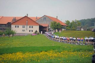 The Tour de Romandie peloton en route to the finish in Romont.