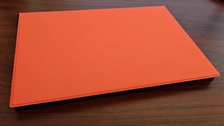 Jsaux FlipGo with orange cover sitting on desk