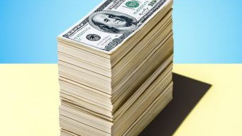 Money stacked on table