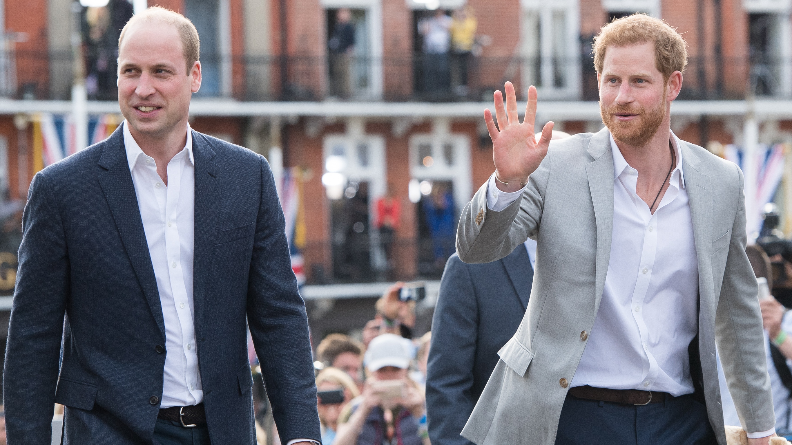 Prince Harry and Prince William greet the public in Windsor on the eve of the wedding at Windsor Castle