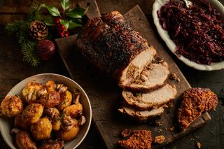 Jamie Oliver's show-stopping festive porchetta, crispy root veg and best-ever roast potatoes.