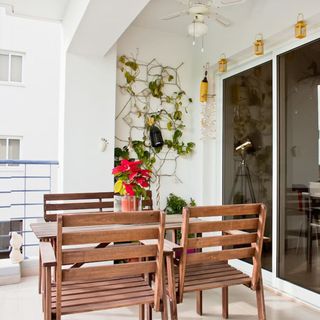 open balcony with table and chair and sliding door