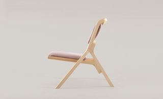 Side view of Frame reading chair with pink padding