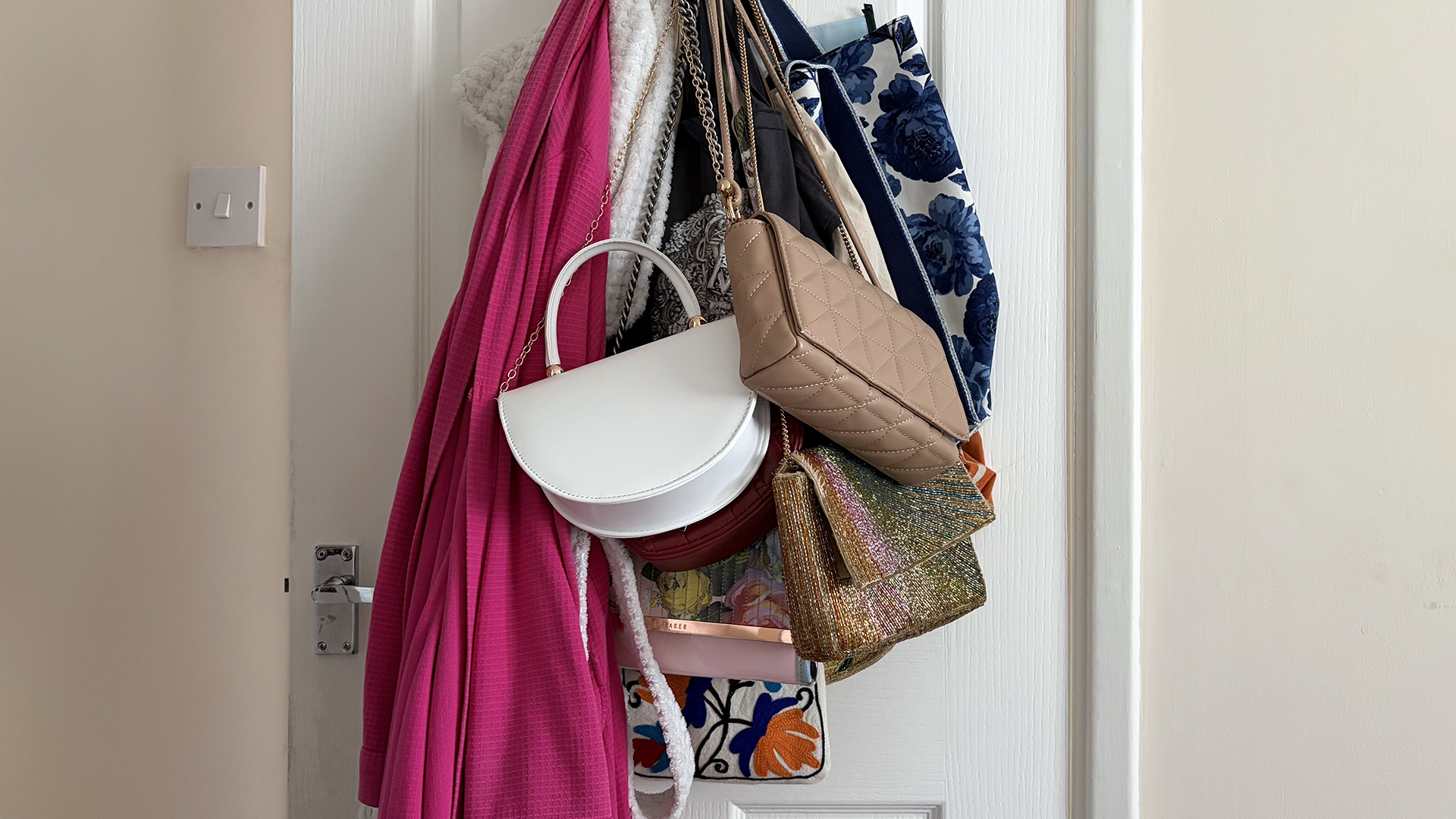 The door in sleep writer Ruth Jones' bedroom. It's weighed down by bags and jackets.