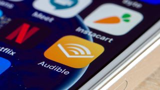 A close-up of the Audible app icon on a mobile phone