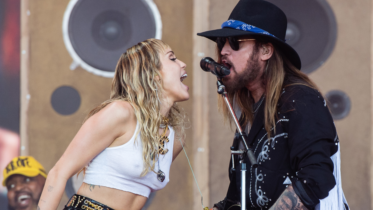 Miley Cyrus and Billy Ray Cyrus perform on the Pyramid Stage during day five of Glastonbury Festival at Worthy Farm, Pilton on June 30, 2019 in Glastonbury, England.