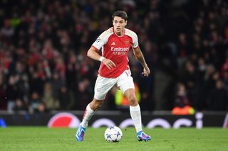 Jakub Kiwior of Arsenal runs with the ball during the UEFA Champions League match between Arsenal FC and Sevilla FC at Emirates Stadium on November 08, 2023 in London, England. (Photo by Stuart MacFarlane/Arsenal FC via Getty Images)