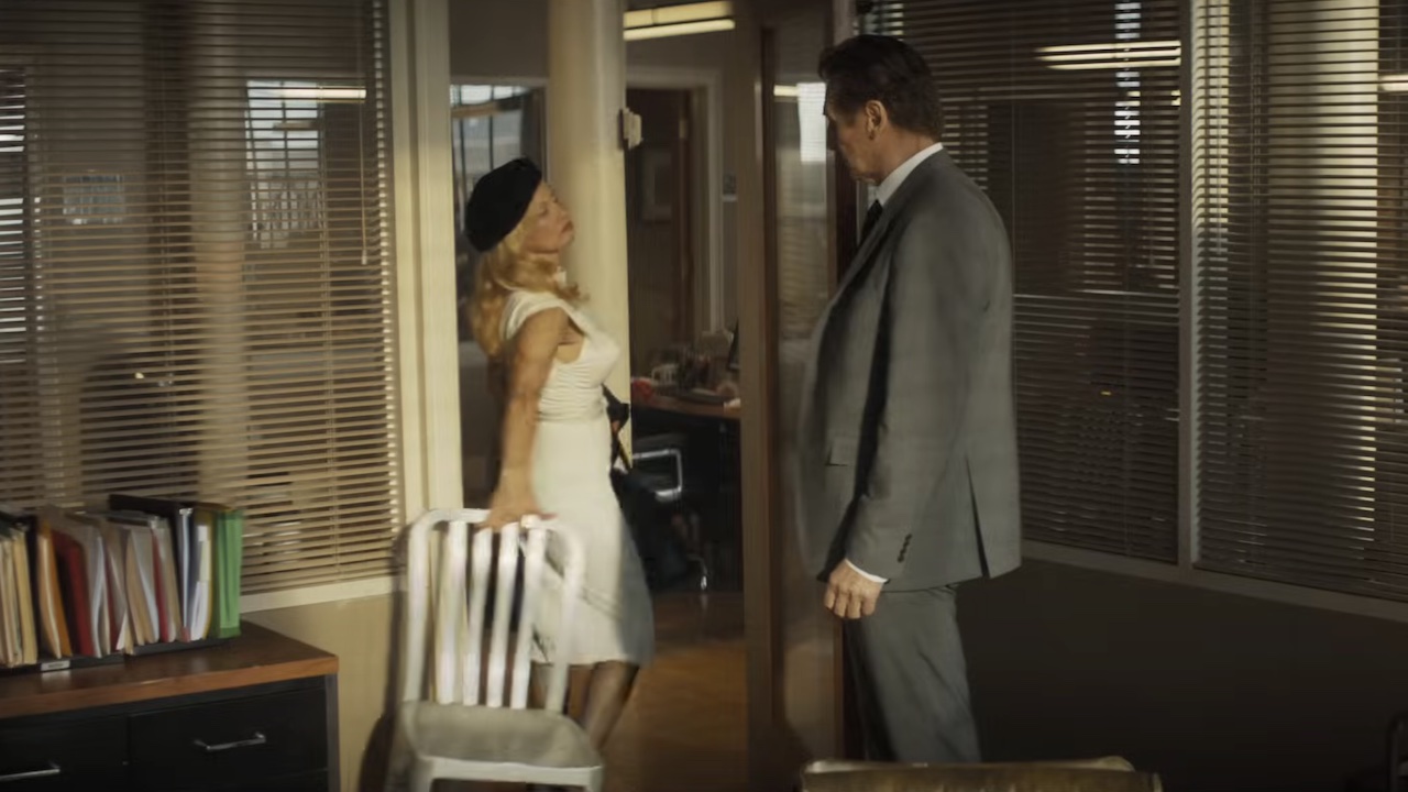 Beth taking chair out of Frank Jr.'s office in The Naked Gun reboot