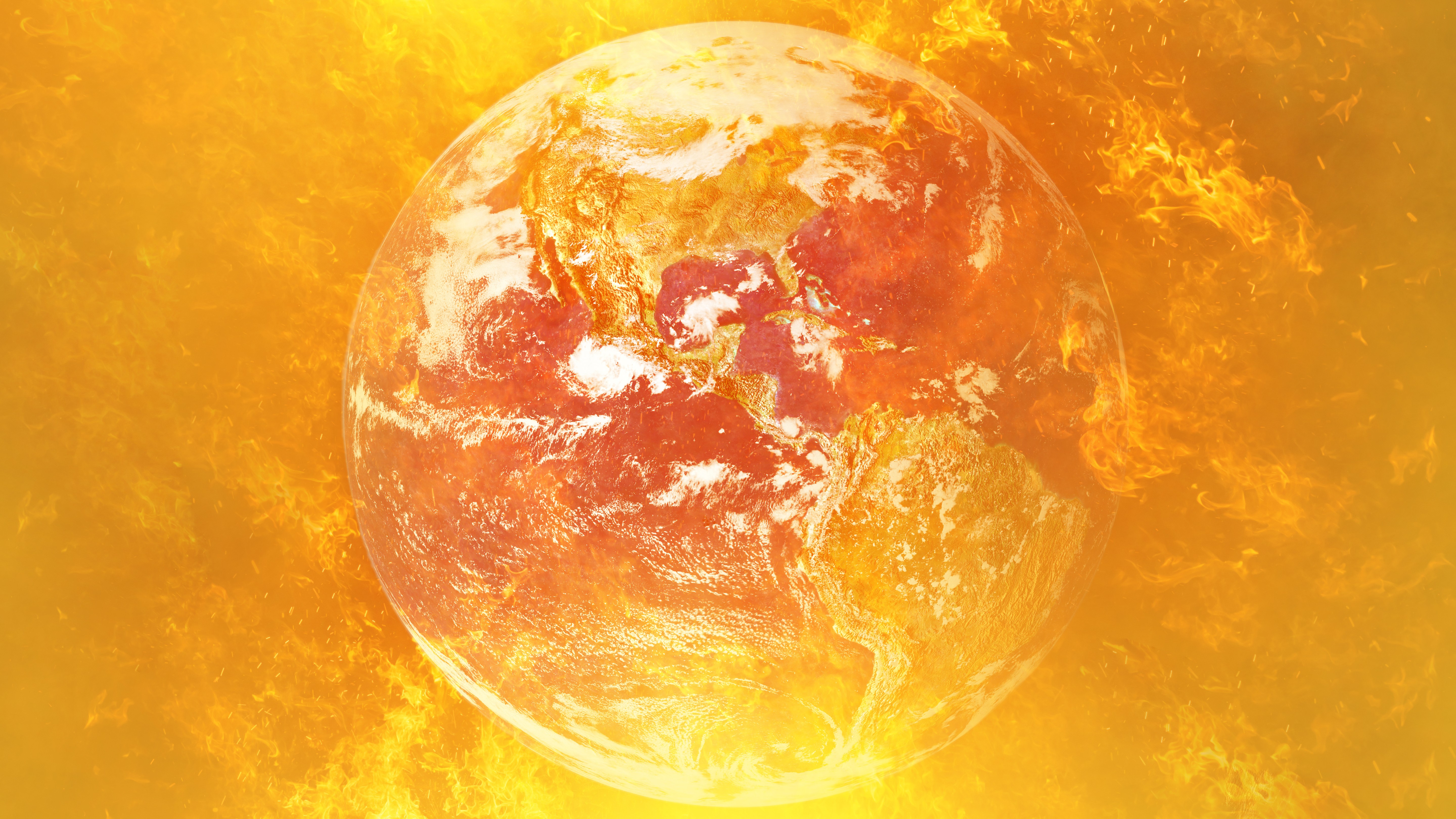 Planet Earth is engulfed in orange flames.