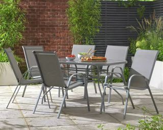 Argos Home Sicily 6 Seater Metal Patio Set on a patio with food on table