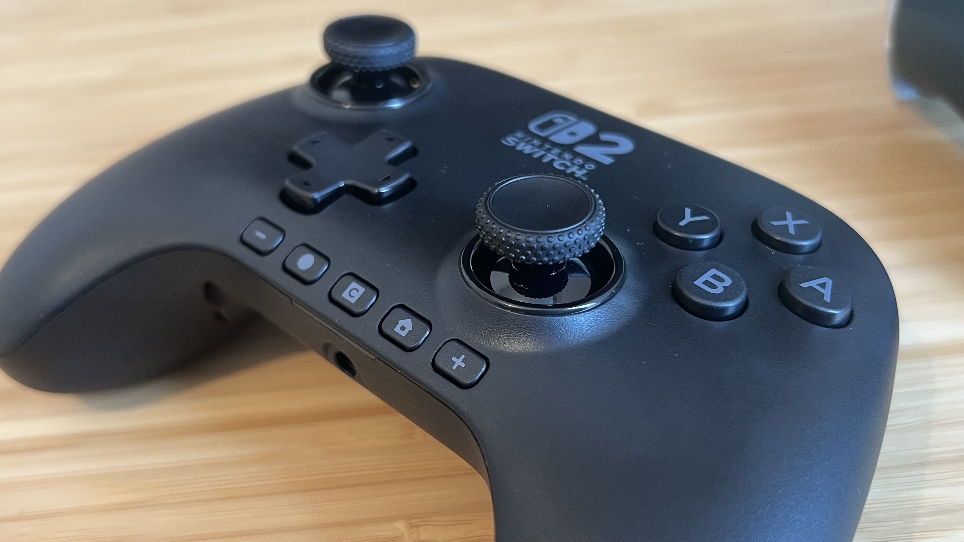 PowerA Advantage Controller for Nintendo Switch 2 on a wooden desk