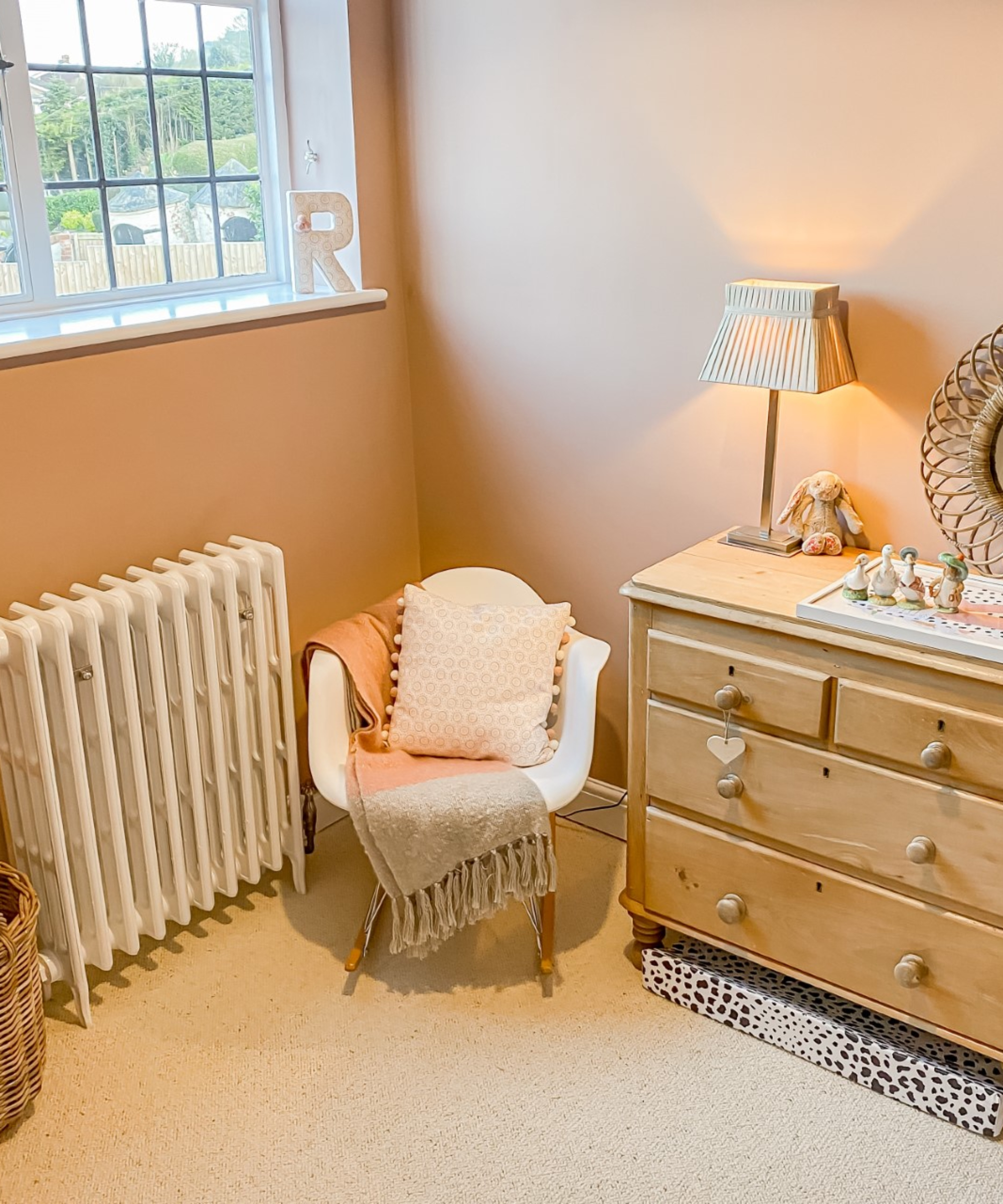 white cast iron radiator in child&#039;s bedroom