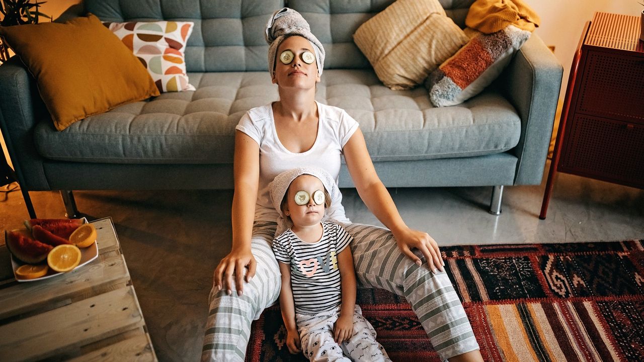 mother and daughter doing a face mask