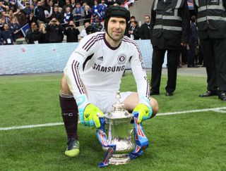 Goalkeeper Petr Cech poses with the FA Cup after Chelsea's victory over Liverpool in the 2012 final