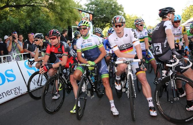 Andr&eacute; Greipel and Cadel Evans wait for the start