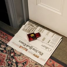 Trudon 45 perfume shot on a newspaper in an opulent hotel