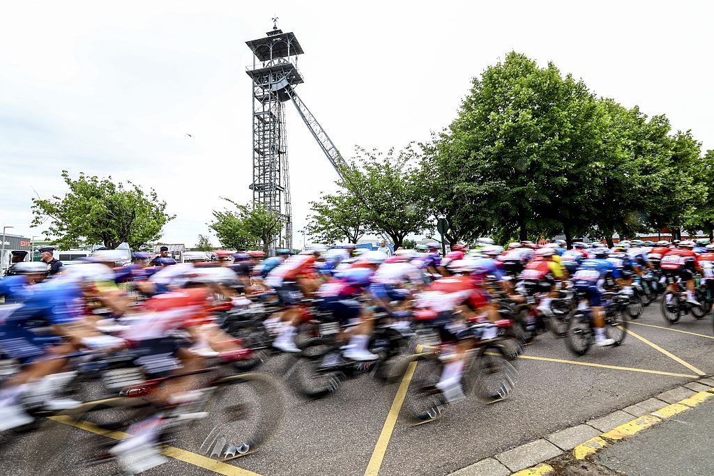 The pack of riders pictured in action during the first stage, Lille Metropole to Lille Metropole (185 km), of the 2025 Tour de France cycling race, in Lille, France, on Saturday 05 July 2025. The 112th edition of the Tour de France starts on Saturday 5 July in Lille, France, and will finish in Paris, France on the 27th of July. BELGA PHOTO DAVID PINTENS (Photo by DAVID PINTENS / BELGA MAG / Belga via AFP)