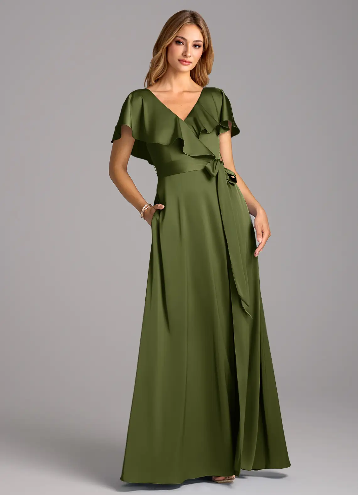 A model wearing a green ruffle sleeved Azazie gown