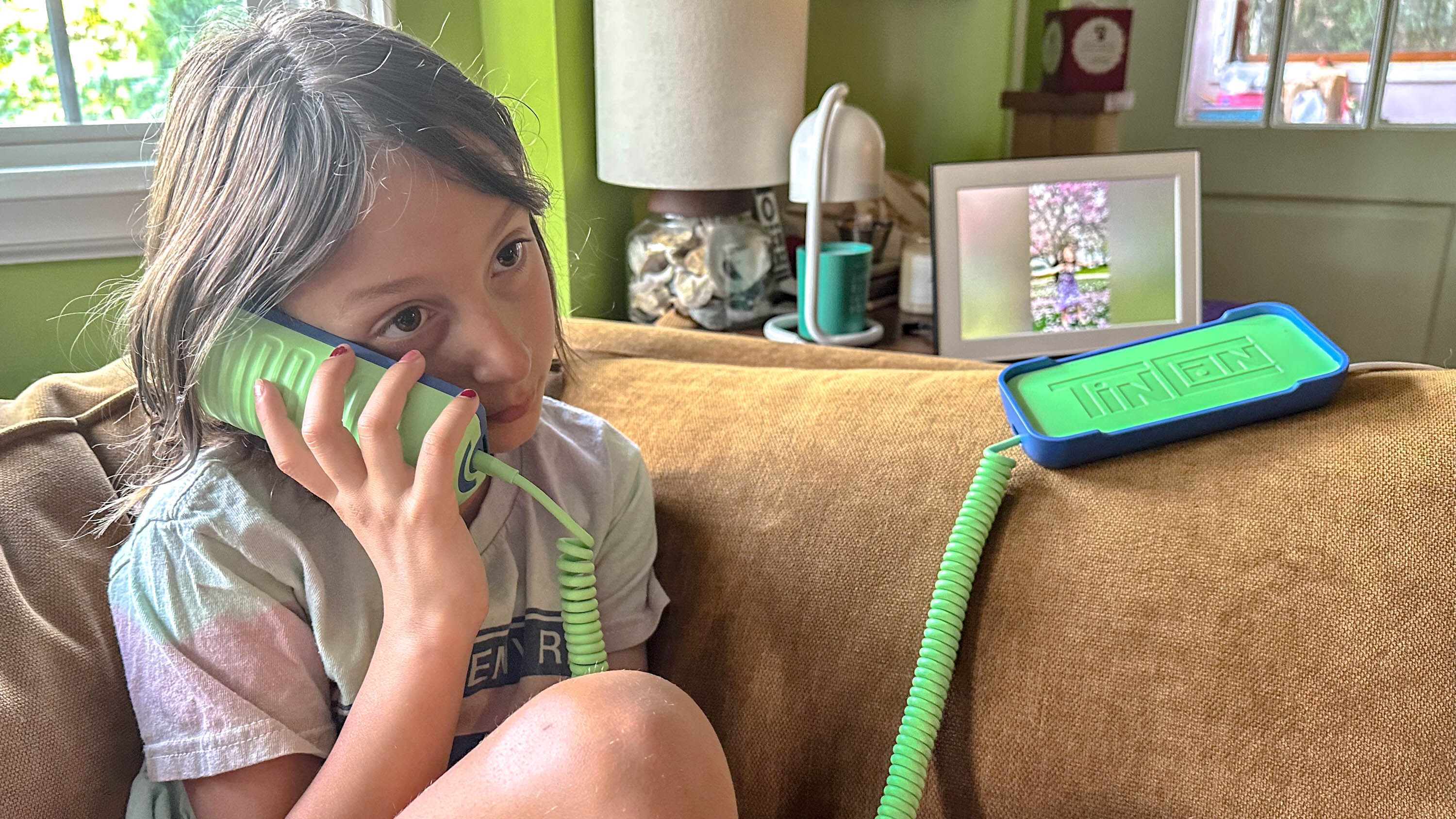 Girl talking on Tin Can phone