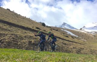 Quintana waves as he climbs in the Pyrenees