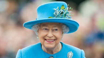 Queen Elizabeth II tours Queen Mother Square on October 27, 2016 in Poundbury, Dorset