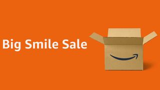 An open Amazon box with the words Big Smile Sale next to it