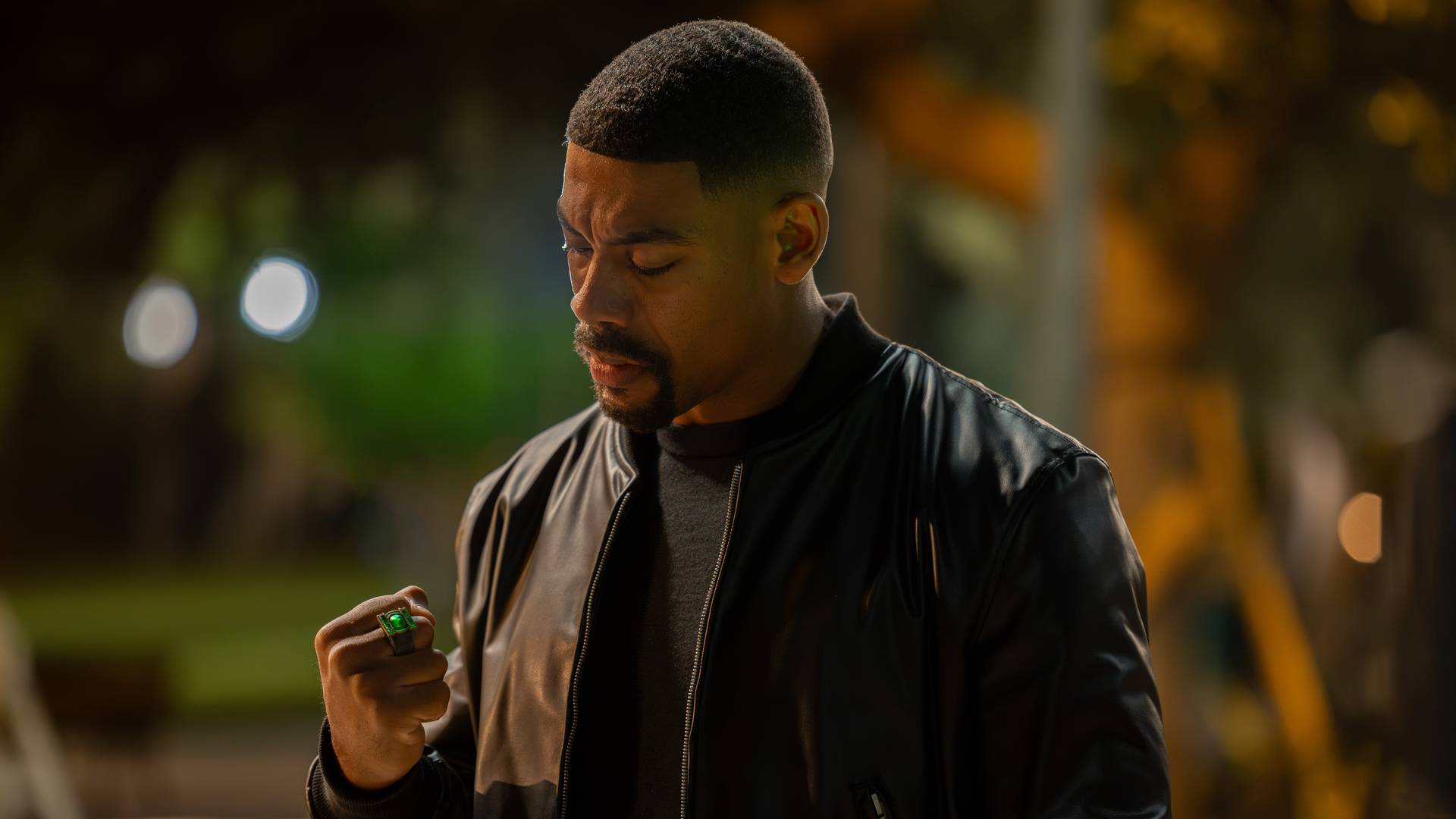 John Stewart (Aaron Pierre) looking at his Lantern ring in Lanterns season 1