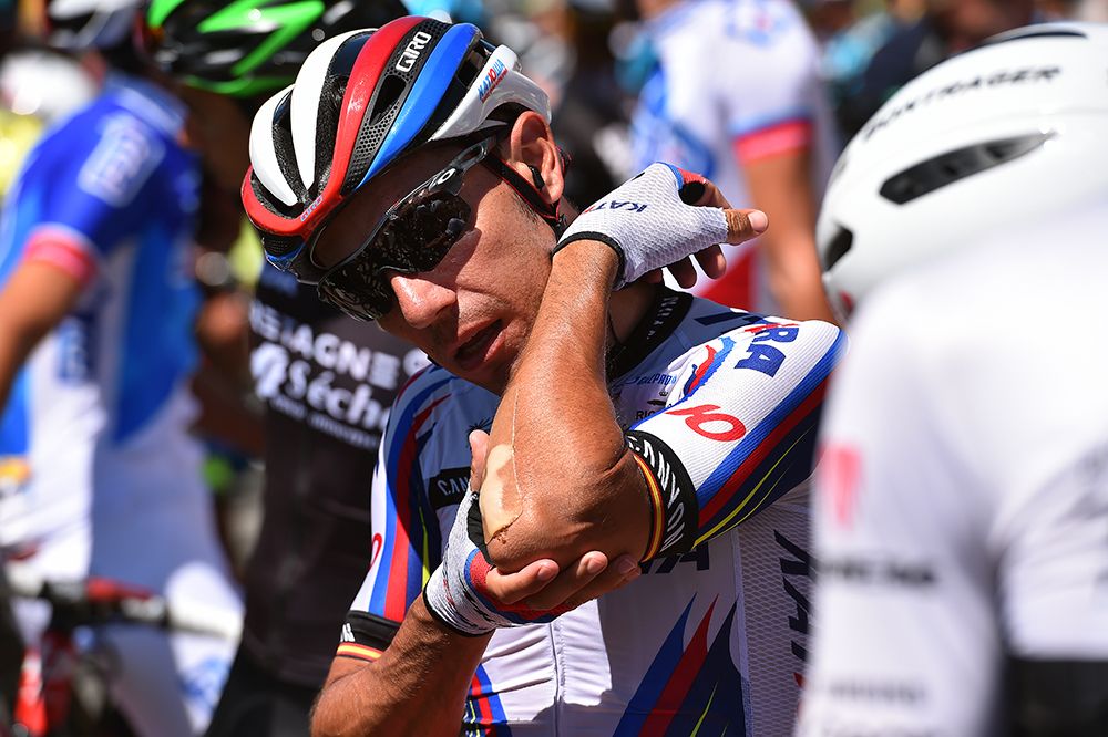 Joaquim Rodriguez checks his bandages