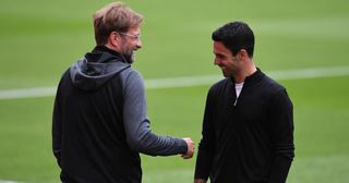 Liverpool and Arsenal managers Jurgen Klopp and Mikel Arteta respectively before the Premier League match between Arsenal FC and Liverpool FC at Emirates Stadium on July 15, 2020 in London, England.