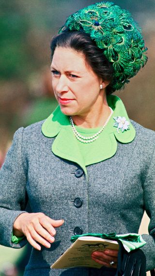 Princess Margaret wearing peacock feather hat