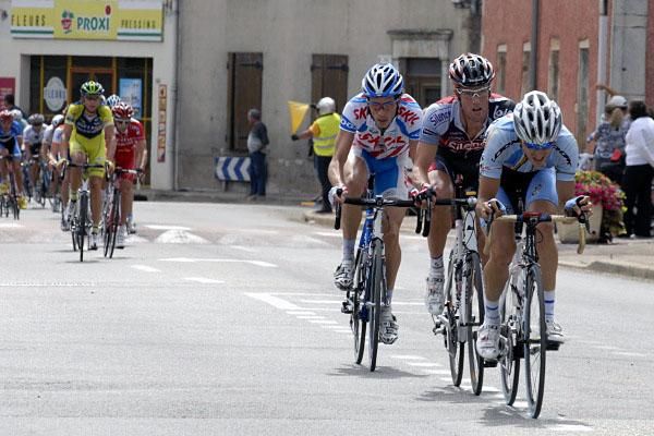 A trio of riders has a go at getting away.