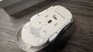 Orbital Pathfinder gaming mouse with various attachments.