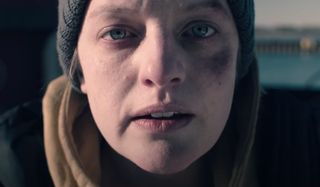 Elisabeth Moss looks bruised and dazed in The Handmaid's Tale.