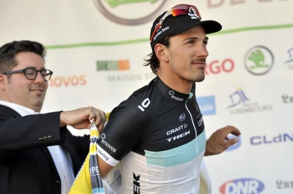 Fabian Cancellara (Leopard Trek) dons the leader's yellow jersey.
