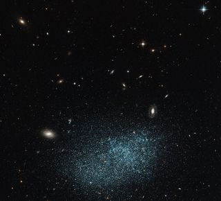 Astronomers class UGC 9128, shown here, as a dwarf irregular galaxy, It lacks a well-defined shape, and probably contains only around one hundred million stars, far fewer than are found in a large spiral galaxy such as the Milky Way. UGC 9128 lies about 8