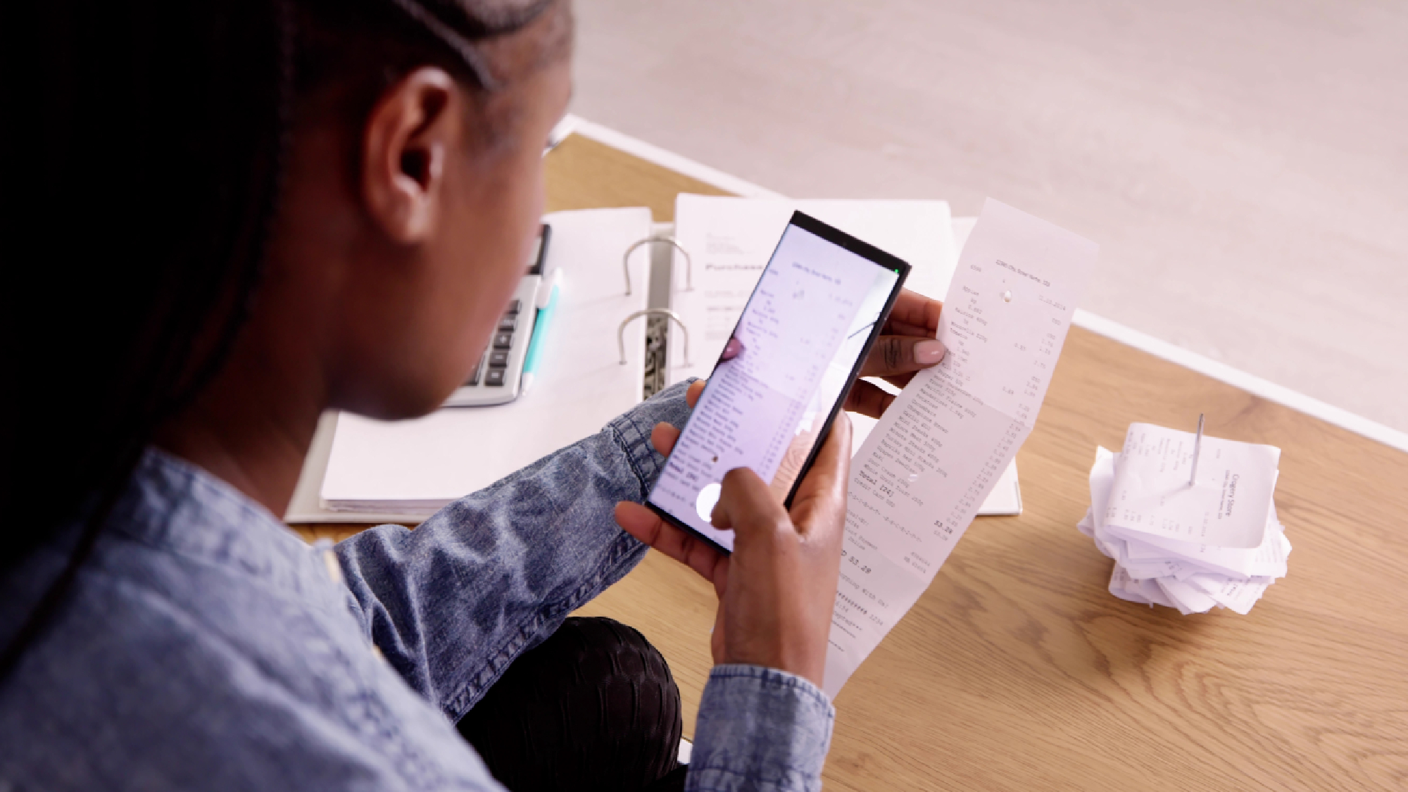 Woman taking picture of receipt 