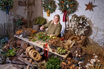 Amid a cornucopia of wreath-making materials, Ellie Taylor works her magic.