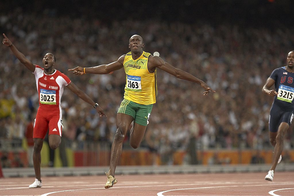 Track &amp; Field: 2008 Summer Olympics: Jamaica Usain Bolt (2163) in action, winning Men's 100M Final gold medal with world record time of 9.69 vs Trinidad &amp; Tobago Richard Thomson (3025) and USA Darvis Patton (3215) at National Stadium ( Bird's Nest ). Thompson won silver and Patton finished 8th. Beijing, China 8/16/2008 