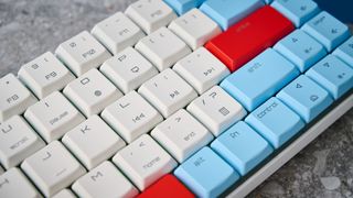 A Cherry MX LP 2.1 low-profile keyboard with red, white and blue keycaps