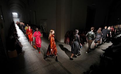 A cat walk featuring 20 male and female models. 