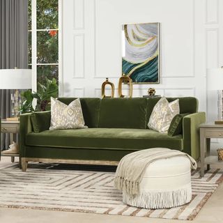A dark olive green couch