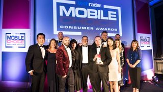The Huawei team on stage collecting the Manufacturer of the Year award with presenter Kerry Godliman and TechRadar's UK Editor in Chief Gareth Beavis 