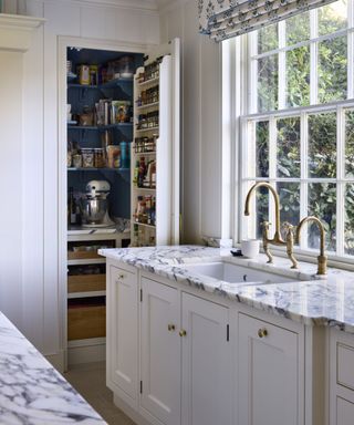 White cabinets, blue inside, kitchen sink