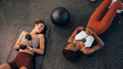 Dumbbell exercises: Two women in the gym