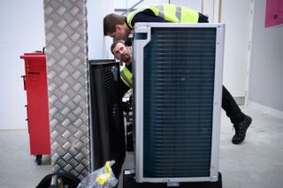 An air source heat pump being installed